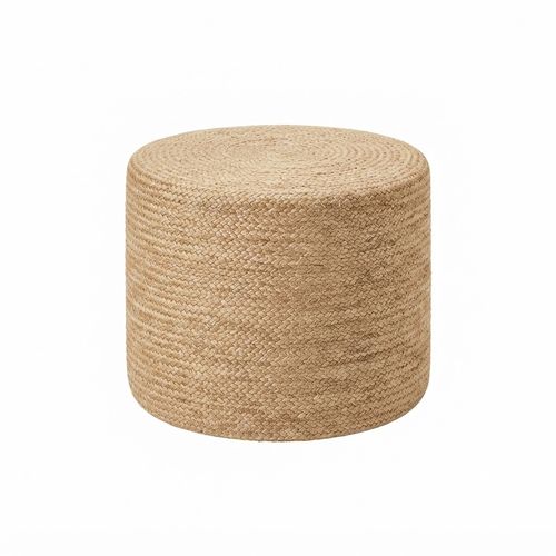 Natural braided jute pouf ottoman beside a linen sofa