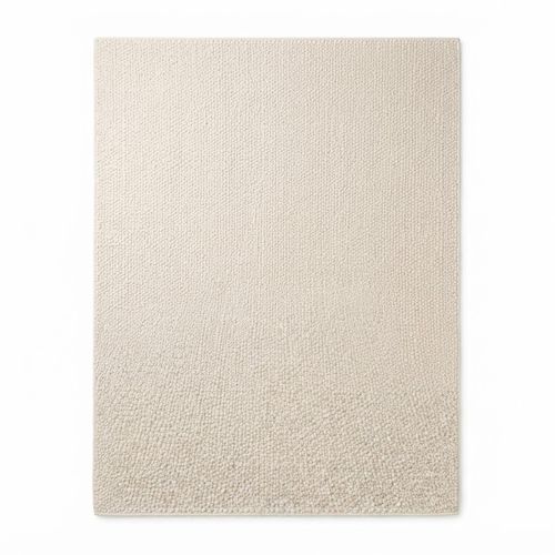Large ivory wool area rug across a great room
